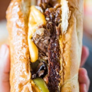 Slow Cooker Philly Cheese Steak Sandwiches that are so tender and flavorful you'll feel like you're in Philly. Perfect for a crowd!